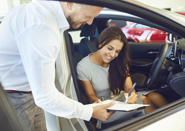 Woman Signing for Car